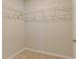 A standard-sized closet featuring carpeted floors and wire shelving with ample space for storage at 1453 Ne 161St Pl, Citra, FL 32113