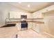 Well-appointed kitchen with stainless steel appliances, ample cabinet space, and modern countertops at 1453 Ne 161St Pl, Citra, FL 32113