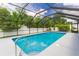 Screened in ground swimming pool with crystal blue water ready for Gathering enjoyment and fun at 1453 Ne 161St Pl, Citra, FL 32113