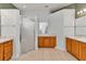 Bathroom with tiled floors, double vanities and a glass-enclosed shower at 15239 Sw 15Th Terrace Rd, Ocala, FL 34473