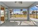 Large screened lanai with tile flooring provides stunning views of the surrounding golf course and sky at 15239 Sw 15Th Terrace Rd, Ocala, FL 34473