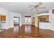 Spacious living room with hardwood floors, and neutral paint with an archway leading to the kitchen at 15239 Sw 15Th Terrace Rd, Ocala, FL 34473