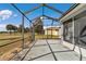 Screened patio offers a relaxing space with views of the golf course and landscaped surroundings at 15239 Sw 15Th Terrace Rd, Ocala, FL 34473