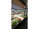 View of backyard from covered patio with shade screen at 2219 Ne 18 Ave, Ocala, FL 34470