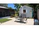 Backyard view showcasing the patio, shed, and screened-in porch at 2219 Ne 18 Ave, Ocala, FL 34470