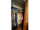 Organized closet with hanging clothes and storage space, showcasing functionality at 2219 Ne 18 Ave, Ocala, FL 34470