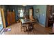 Traditional dining room with wooden table, chairs, and hardwood floors with matching hutch at 2219 Ne 18 Ave, Ocala, FL 34470