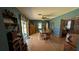 Inviting dining room featuring a wood table and chairs, and a sliding glass door at 2219 Ne 18 Ave, Ocala, FL 34470