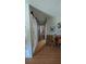 Hallway with light green walls and wood floors and accent chairs at 2219 Ne 18 Ave, Ocala, FL 34470