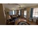 Comfortable living room featuring hardwood floors, ceiling fan, with a view to the lanai at 2219 Ne 18 Ave, Ocala, FL 34470