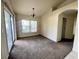 Dining area showcasing carpet flooring and sliding glass door to the exterior at 26 Hemlock Circle Way, Ocala, FL 34472