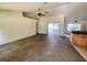 Open-plan living room with neutral walls and carpet, sliding glass doors to the exterior at 26 Hemlock Circle Way, Ocala, FL 34472