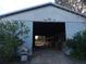 Inside a barn with a wide opening, revealing well-maintained stalls, and offering a functional equestrian space at 2630 Nw 140Th St, Citra, FL 32113