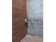 Close-up of a horse stall corner with gray cinder block and wood wall, showing the automatic watering system at 2630 Nw 140Th St, Citra, FL 32113