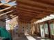 Unfinished home interior displaying exposed wooden framing, revealing the structural elements of the construction at 2630 Nw 140Th St, Citra, FL 32113