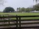 Picturesque pasture with horses grazing and wooden fencing at 2630 Nw 140Th St, Citra, FL 32113