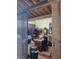 Interior of tack room with saddles, storage, and a table, providing a functional space for equestrian needs at 2630 Nw 140Th St, Citra, FL 32113