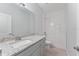 Bathroom with granite countertops and shower featuring subway tile at 288 N Oak Ave, Sanford, FL 32771