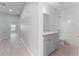 Bright bathroom features a granite countertop and shower with white subway tile at 288 N Oak Ave, Sanford, FL 32771