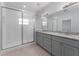 Bathroom with a glass-enclosed shower and a double vanity with granite countertops at 288 N Oak Ave, Sanford, FL 32771