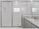 Bright bathroom featuring a glass shower with white subway tile and granite vanity at 288 N Oak Ave, Sanford, FL 32771
