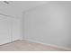 Clean and simple bedroom with spacious closet and light wood floors at 288 N Oak Ave, Sanford, FL 32771