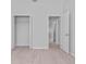 Spacious bedroom with closet, light wood-look floors, and neutral walls at 288 N Oak Ave, Sanford, FL 32771