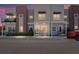 Charming townhouse exterior with modern architectural details, muted color palette, and manicured landscaping at 288 N Oak Ave, Sanford, FL 32771