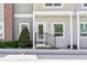 Inviting condo front entrance with neat landscaping and stylish architectural details at 288 N Oak Ave, Sanford, FL 32771