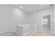 Upstairs hallway with wood floors and an open view of the downstairs at 288 N Oak Ave, Sanford, FL 32771