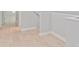 Hallway features base trim, light hardwood floors, and neutral wall color at 288 N Oak Ave, Sanford, FL 32771