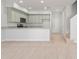 Modern kitchen with stainless steel appliances, granite countertops, and wood floors at 288 N Oak Ave, Sanford, FL 32771