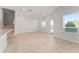 Open-plan living space with wood floors, light walls, and a staircase at 288 N Oak Ave, Sanford, FL 32771