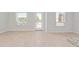 Bright open-plan living space with light wood flooring and neutral walls at 288 N Oak Ave, Sanford, FL 32771