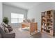 Bright office space with a large desk, built-in bookcase, and comfortable seating area at 288 N Oak Ave, Sanford, FL 32771