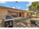 Inviting back deck features an outdoor dining area, a built-in grill, and a cozy fire pit at 2940 N Huron Dr, Deltona, FL 32738