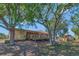 Exterior shot of the backyard with a wooden deck and lush greenery providing privacy at 2940 N Huron Dr, Deltona, FL 32738