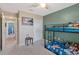 Bedroom with bunk beds and a view into the hallway with another room at 2940 N Huron Dr, Deltona, FL 32738