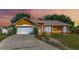 Charming single-story home with a well-manicured lawn, inviting entrance and two car garage at 2940 N Huron Dr, Deltona, FL 32738