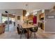 Kitchen featuring granite countertops, wooden cabinets, tile backsplash, and a breakfast bar with seating at 2940 N Huron Dr, Deltona, FL 32738