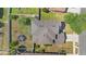 Birds-eye view of home with fenced backyard, mature trees, trampoline, and convenient access to the street at 3970 Sw 51St Ter, Ocala, FL 34474