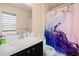 Bathroom featuring a toilet, vanity, and shower with colorful shower curtain at 3970 Sw 51St Ter, Ocala, FL 34474