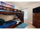 Bedroom featuring bunk beds, a dresser, and wood floors at 3970 Sw 51St Ter, Ocala, FL 34474