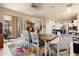 Open dining room with modern furniture and access to outdoor living at 3970 Sw 51St Ter, Ocala, FL 34474