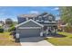 Charming two-story home with a well-maintained lawn, two car garage, and inviting curb appeal at 3970 Sw 51St Ter, Ocala, FL 34474