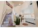 Welcoming foyer featuring high ceilings, colorful stair risers, and easy access to the living area at 3970 Sw 51St Ter, Ocala, FL 34474