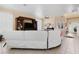 Spacious living room showcasing tile floors, high ceilings, and an entertainment center, ideal for gatherings at 3970 Sw 51St Ter, Ocala, FL 34474