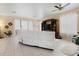 Comfortable living room with tile flooring, large windows, and a view of the backyard at 3970 Sw 51St Ter, Ocala, FL 34474