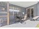 Enclosed patio features a table setting with four chairs, an ideal outdoor space for relaxation at 3970 Sw 51St Ter, Ocala, FL 34474