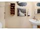 Bathroom decor with mounted decorative wall shelves and coastal art at 3970 Sw 51St Ter, Ocala, FL 34474
